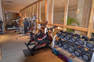 a gym with exercise equipment in a building at Taj Luxury Suite in Cape Town
