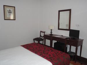 Een bed of bedden in een kamer bij Hotel Rural Quinta de Santo Antonio