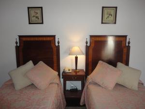 Een bed of bedden in een kamer bij Hotel Rural Quinta de Santo Antonio