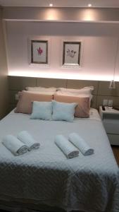 A bed or beds in a room at Loft Res Pedra Azul - hospedagem nas montanhas