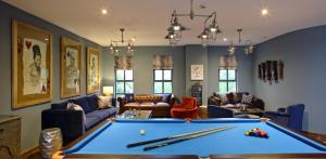 a living room with a pool table at Latitude 0 Degrees in Kampala