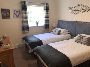 A bed or beds in a room at The Shelbourne 