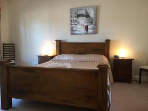 a bedroom with a bed and a lamp at The Nosh & Nod - Howick Street in York
