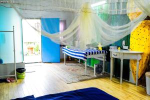 Voodi või voodid majutusasutuse Yellow House Hostel Huizhou West Lake toas