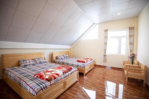 Postel nebo postele na pokoji v ubytování HUNA House