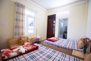 Postel nebo postele na pokoji v ubytování HUNA House