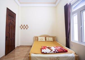 Postel nebo postele na pokoji v ubytování HUNA House