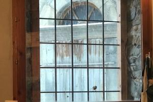 a wooden door with a window in a room at Boréales - spacious duplex - in La Grave-La Meije heart in La Grave