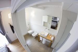 an overhead view of a bathroom with a toilet and a sink at B&B Chez Moi Lame 57 in Bologna