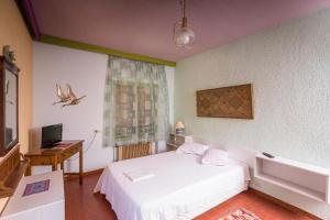 מיטה או מיטות בחדר ב-delphi villa Terracotta