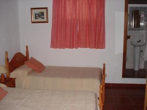 A bed or beds in a room at Casa Rural La Era Vieja en Vallehermoso La Gomera