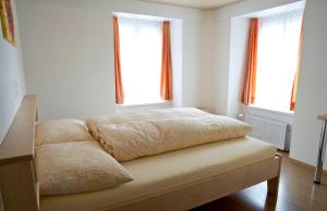 Postel nebo postele na pokoji v ubytování Hotel Alpina