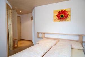 Postel nebo postele na pokoji v ubytování Hotel Alpina