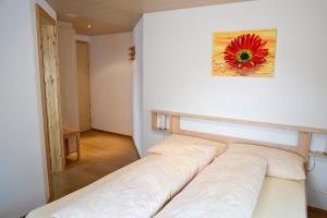 Postel nebo postele na pokoji v ubytování Hotel Alpina