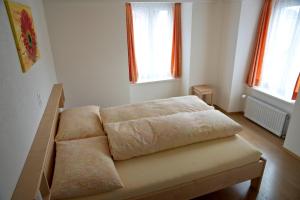 Postel nebo postele na pokoji v ubytování Hotel Alpina