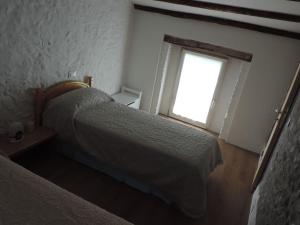 Letto o letti in una camera di Casa Rossa