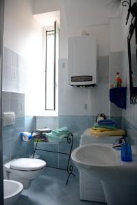 a bathroom with a sink and a toilet and a microwave at Ciassa Noeva in Pieve di Teco +31 photos