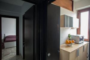 Kuchyň nebo kuchyňský kout v ubytování Attiko B&B