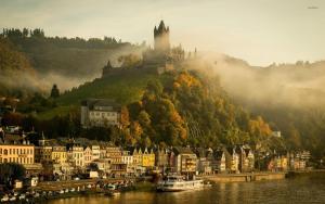 a town with a castle on top of a hill at Gästehaus Paulina in Cochem