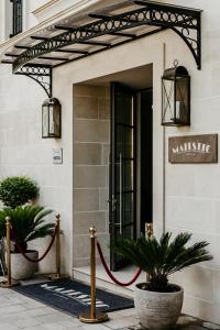 a door to a building with a red rope around it at Hotel Majestic in Budva