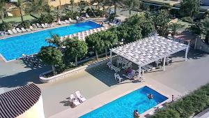 an overhead view of a swimming pool at a resort at Racar Hotel in Frigole