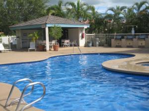 a large blue swimming pool with a gazebo at Maui Banyan G310C in Wailea