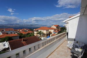 a view of the city from the balcony of a house at Apartments Aldica - 300 m from sea in Supetar