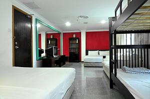 Ein Bett oder Betten in einem Zimmer der Unterkunft Hotel China Town 2
