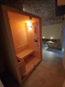 Postel nebo postele na pokoji v ubytování Castello di Fagnano -Albergo Diffuso & SPA