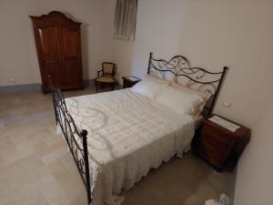 Postel nebo postele na pokoji v ubytování Castello di Fagnano -Albergo Diffuso & SPA