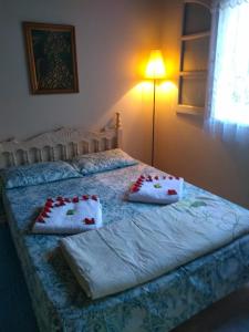 Uma cama ou camas num quarto em Chalé da Paz