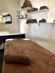 a room with a brown pillow on a bed at Peppercorn Beach Resort in Phú Quốc