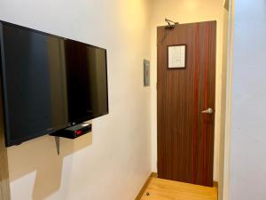 TV a/nebo společenská místnost v ubytování Davao Persimmon Suites