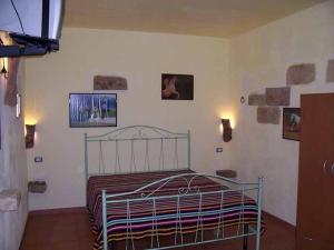 Postel nebo postele na pokoji v ubytování Le Camporelle In Campagna