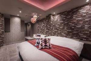 Postel nebo postele na pokoji v ubytování HOTEL FARINA DOLCE (Adult Only)