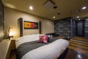 Postel nebo postele na pokoji v ubytování HOTEL FARINA DOLCE (Adult Only)