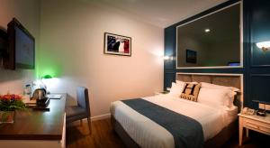 Postel nebo postele na pokoji v ubytování H Boutique Hotel Sri Petaling