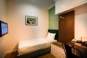 Postel nebo postele na pokoji v ubytování H Boutique Hotel Sri Petaling