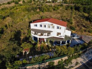 an overhead view of a white house with a red roof at Joni Restaurant in Pogradec