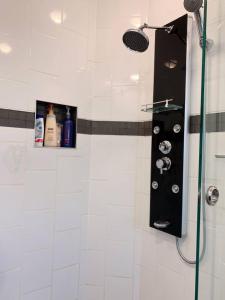 a bathroom with a shower with a shower head at Nice rooms with private bath in Mid Town Toronto in Toronto