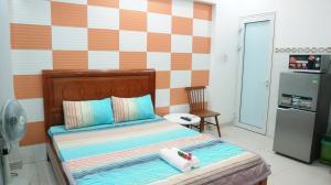 Giường trong phòng chung tại Smiley Apartment 8