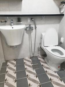 a bathroom with a toilet and a sink at Grace River House Block A - Couple Room in Hoengsong