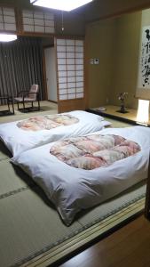 A bed or beds in a room at Senjukaku