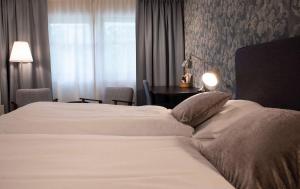 Postel nebo postele na pokoji v ubytování Best Western Tingvold Park Hotel + 37 fotografií