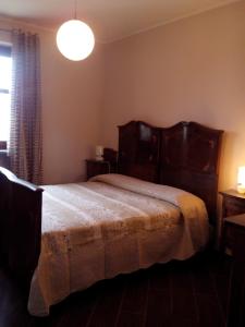 Ένα ή περισσότερα κρεβάτια σε δωμάτιο στο Casetta San Giovanni