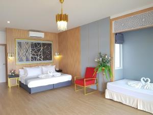 Postel nebo postele na pokoji v ubytování Raya Buri Resort Kanchanaburi