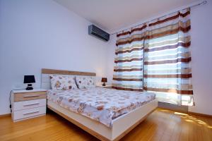 Voodi või voodid majutusasutuse Apartment Dobrota toas