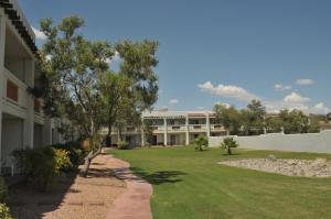 a view of a building with a yard at Los Viajeros Inn in Wickenburg