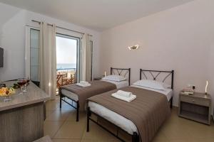 Postel nebo postele na pokoji v ubytování Anesis Hotel