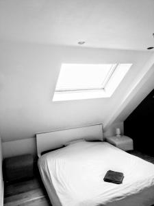 En eller flere senge i et værelse på Studio Flandrien